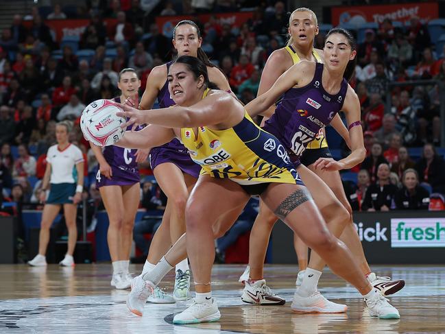 Uneeq Palavi of the Swifts gains possession in the clash against the Queensland Firebirds at Ken Rosewall Arena. Photo: Getty Images