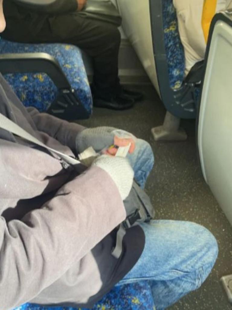 Sydneysiders have expressed their concern online after a train passenger was snapped taking a RAT during the morning commute. Picture: Reddit/@dkslife