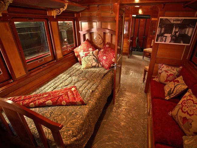 Inside one of the Don River Railway’s first-class suburban carriages that with its leather seats, brass light fittings and comfortable chairs, takes you back to a more genteel age of public transport. Picture: Tourism Australia and Graham Freeman.