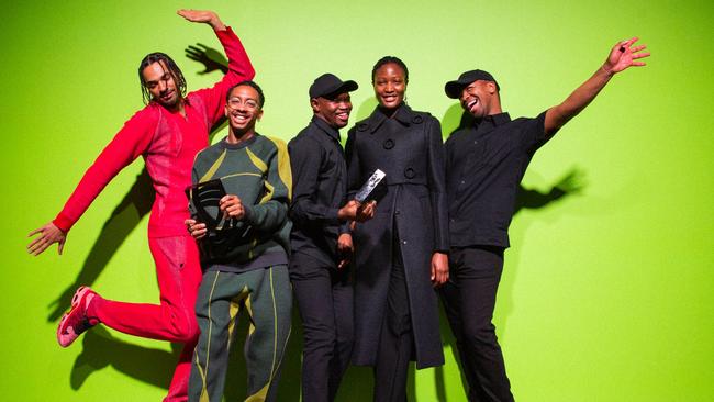 International Woolmark Prize winners 2022: Saul Nash (second from left, with model in red), with innovation winners Mmuso Potsane (centre) and Maxwell Boko (far right, with model) of Mmusomaxwell. Picture: Lillie Eiger.