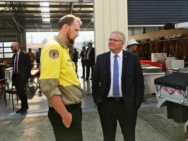 Prime Minister Scott Morrison visits the Huonville Fire Station and talks to a firefighter from NSW. Picture: LUKE BOWDEN