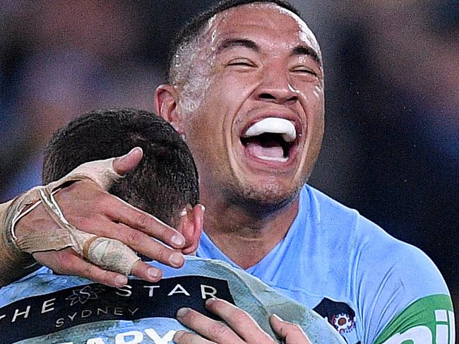 Blues players celebrate following their win over the Maroons during Game 2 of the 2018 State of Origin series between the NSW Blues and the Queensland Maroons at ANZ Stadium in Sydney, Sunday, June 24, 2018. (AAP Image/Dan Himbrechts) NO ARCHIVING, EDITORIAL USE ONLY