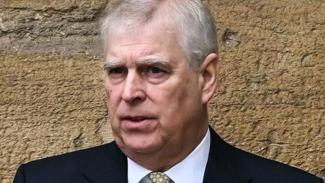 (FILES) Britain's Prince Andrew, Duke of York reacts as he arrives at St. George's Chapel, Windsor Castle, to attend the Easter Mattins Service, on March 31, 2024. A former UK security minister said Friday, december 13, that it was "extremely embarrassing" that a suspected Chinese spy had become a confidant of disgraced royal Prince Andrew. (Photo by JUSTIN TALLIS / AFP)