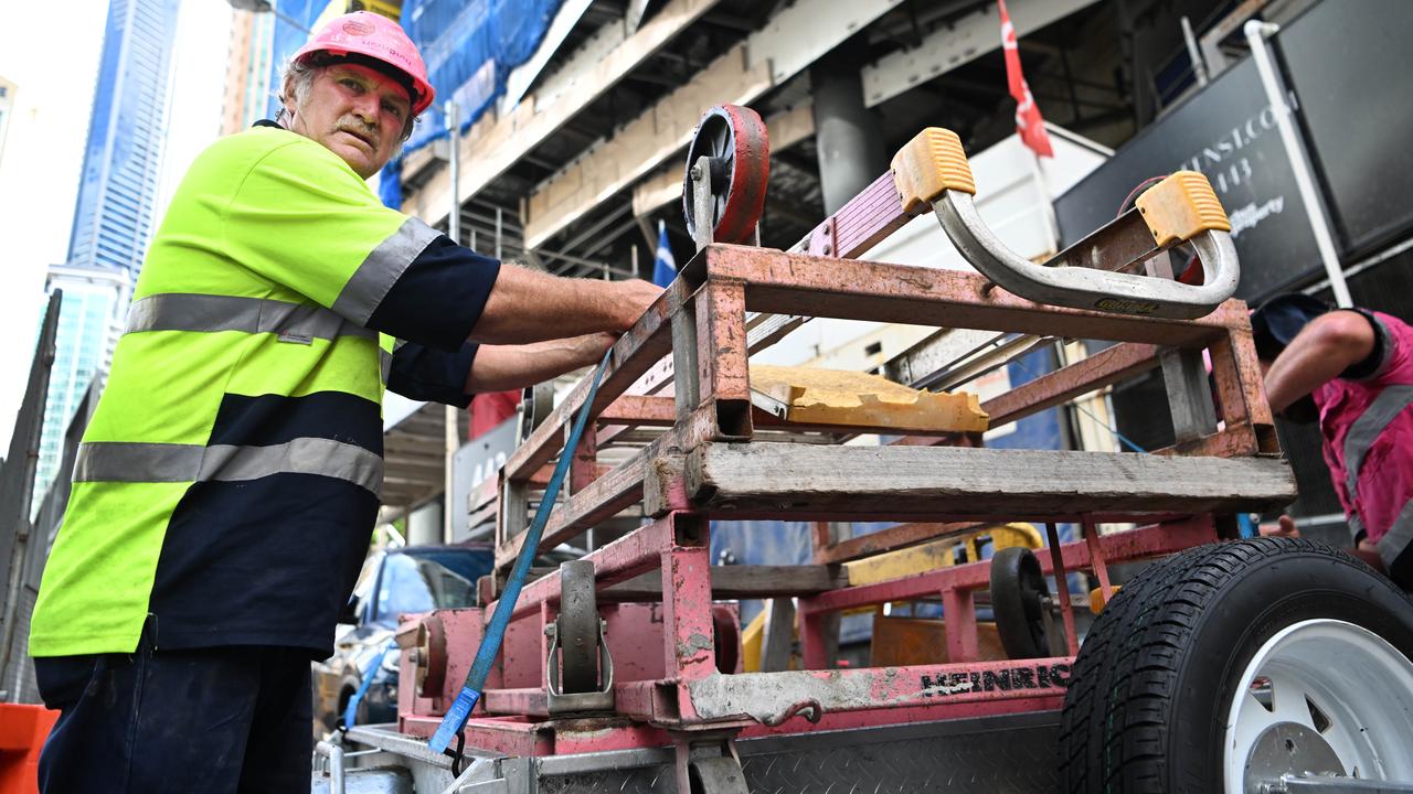 Sub-contractors and tradesmen pack up their equipment and walk off the 443 Queens Street construction site in Brisbane. Picture: NCA NewsWire / Dan Peled