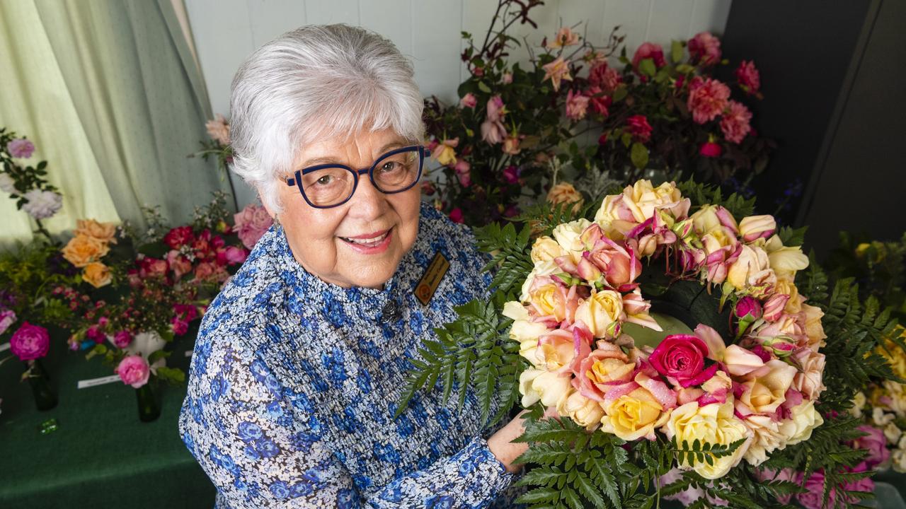 Heritage Roses in Australia member Bonita Cattell with a members wreath on show in the 2022 Spring Champion Rose Show at the Rose Cottage in the Queensland State Rose Garden, Saturday, October 8, 2022. Picture: Kevin Farmer