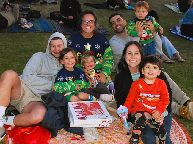 Gavin, Arabella, Gigi, Annalisa, Samantha, Loris, Leo and Luciano getting festive at the Phillip Island Christmas Carols by the Bay at the Cowes Foreshore on Tuesday, December 10, 2024. Picture: Jack Colantuono