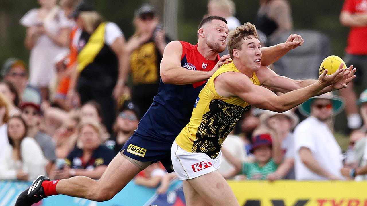 Tom Lynch tries to mark in front of Steven May. Picture: Michael Klein