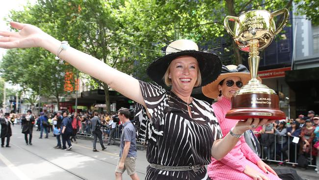 VRC Chairman Amanda Elliott and Lord Mayor Sally Capp hold the Melbourne Cup during last year’s parade. Picture: Michael Klein.