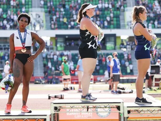 Gwen Berry (left), DeAnna Price, and Brooke Andersen during the national anthem at Saturday’s U.S. Olympic trials Photo: Patrick Smith/Getty Images