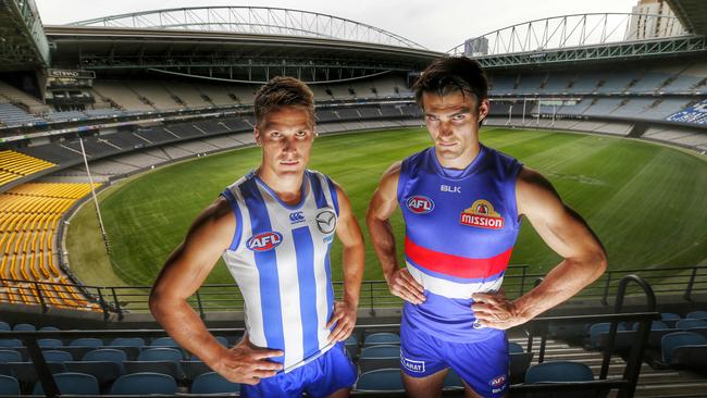 Kangaroos captain Andrew Swallow and Western Bulldogs captain Easton Wood. Picture: Colleen Petch