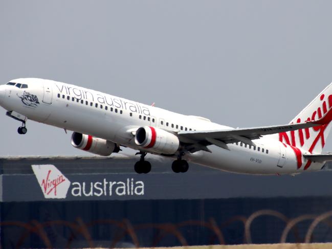 Virgin Australia plane departing from Brisbane Airport Pictures David Clark Photography