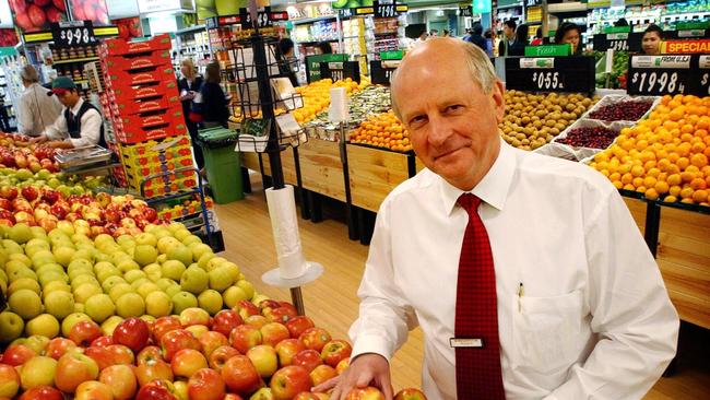 Woolworths CEO Roger Corbett stands by fruit display at the Woolworths supermarket in Sydney.