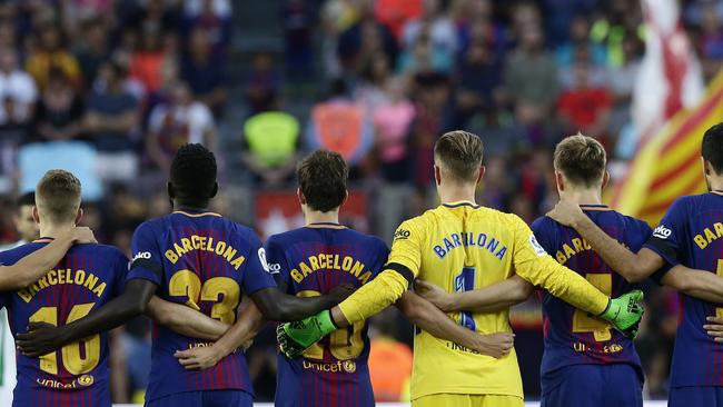 Barcelona players stand for a minute of silence for the victims of the van attacks