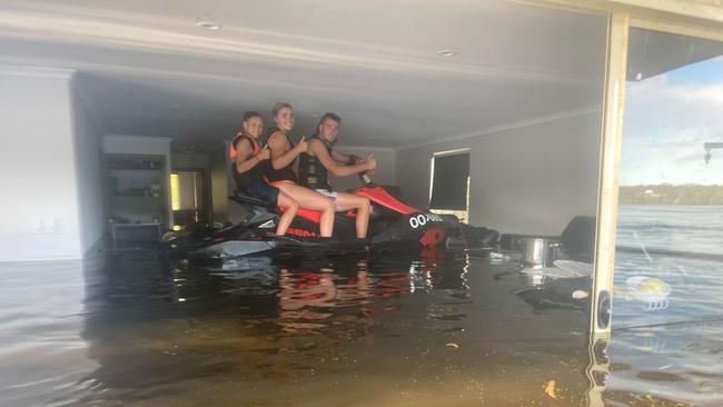 Siblings Ryda , Georgia and Jai Bunker on their jetski inside their upstairs room in their shack on Old Murbko road, Beaumonts. Dec 26th 2022. Picture: Courtney Bunker