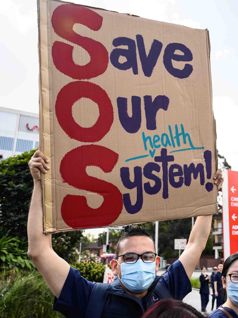 One member held up a sign that read ‘Save Our System’ at Westmead. Picture: NCA NewsWire / James Gourley