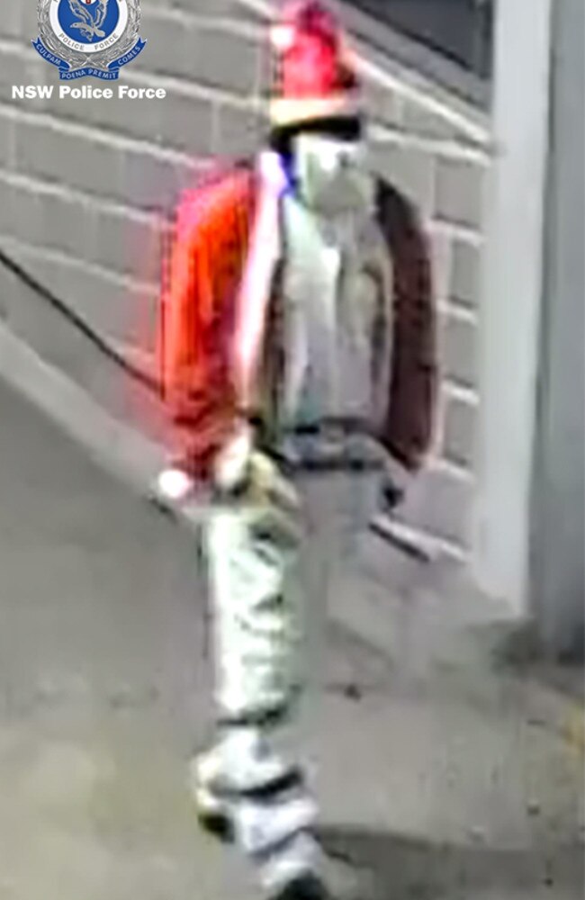 Nonchalant … Bad Santa strolls along into the underground carpark.