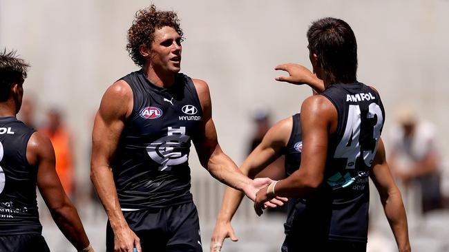 Charlie Curnow has his brother Ed in commentary for the practice game. Picture: Kelly Defina/Getty Images.