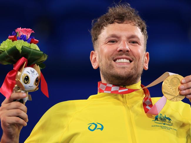 TOKYO, JAPAN - SEPTEMBER 04: Gold medalist  Dylan Alcott of Team Australia reacts in the podium of MenÃ¢â¬â¢s Quad Singles on day 11 of the Tokyo 2020 Paralympic Games at Ariake Tennis Park on September 04, 2021 in Tokyo, Japan. (Photo by Carmen Mandato/Getty Images)