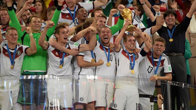 Germany captain Philipp Lahm holds up the World Cup trophy after the 2014 World Cup in Brazil. Picture: AFP