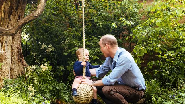 Prince William, Duke of Cambridge, playing with his youngest son Prince Louis in the 'Back to Nature' garden ahead of the RHS Chelsea Flower Show in London. Picture: Matt Porteous / Kensington Palace / AFP