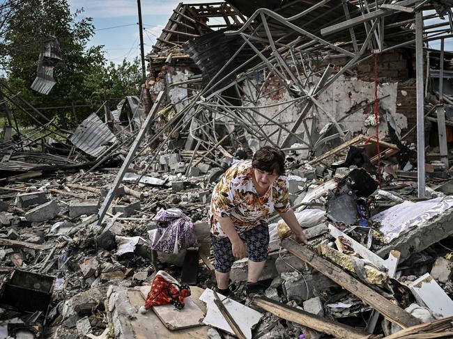 Residents look for belongings in the rubble of their home after a strike destoyed three houses in the city of Slovyansk in the eastern Ukrainian region of Donbas. Picture: AFP