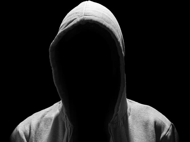 Portrait of Invisible man in the hood isolated on black background creep pervert molestor generic Photo: iStock