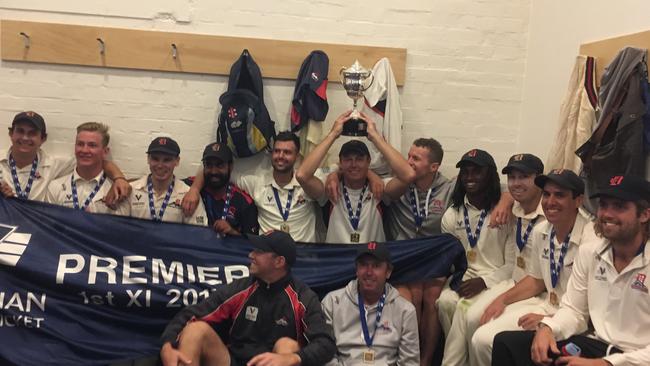 The premiership cup finds a happy home on the head of Darren Pattinson.