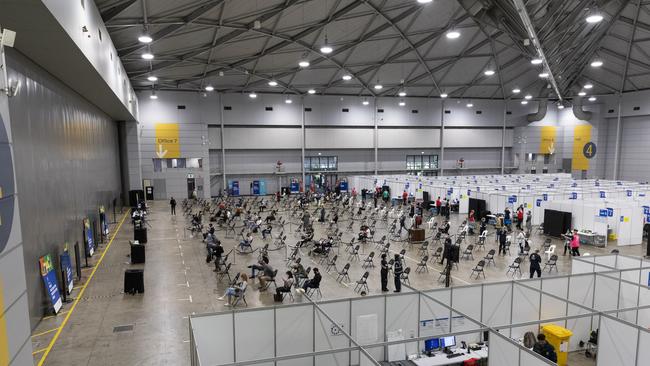 Queenslanders are now rolling up their sleeves at a new vaccination hub at the Brisbane Exhibition and Convention Centre at South Brisbane. Picture: Mark Cranitch.