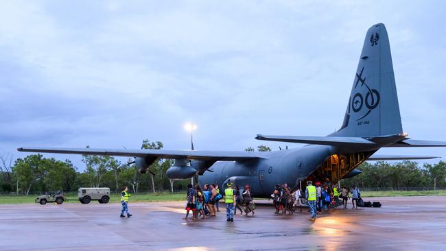 The Royal Australian Air Force assists residents from the Kalkarindji area being evacuated during major flooding in the Northern Territory.