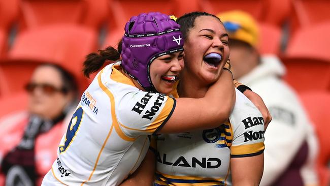 BRISBANE, AUSTRALIA - JULY 27: Kennedy Cherrington of the Eels celebrates with Rueben Cherrington after scoring a try during the round one NRLW match between Brisbane Broncos and Parramatta Eels at Suncorp Stadium on July 27, 2024 in Brisbane, Australia. (Photo by Albert Perez/Getty Images)