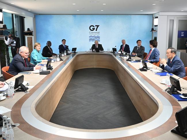 British Prime Minister Boris Johnson (C) takes part in a meeting next to (on right L-R) Biden, Macron, Trudeau, Suga, Morrison, Merkel, Ramaphosa and Moon Jae-in. Picture: Getty Images