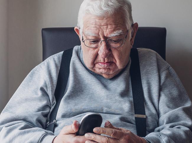 PHONE DILEMMA: He reached for his landline phone to call for family help, but with the power out, it wasn't working