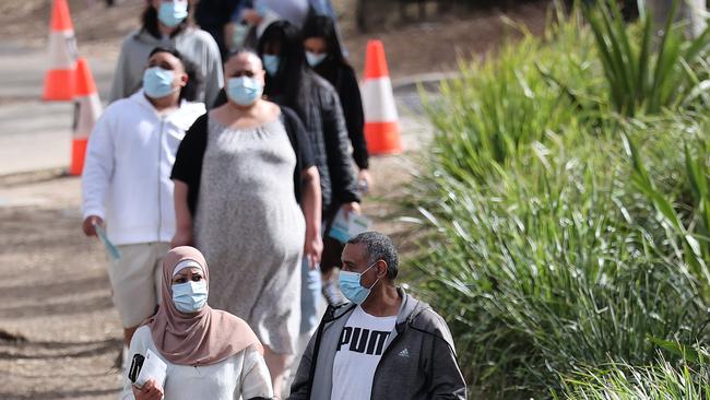 people line up at the Homebush Vaccination centre at Sydney Olympic Park during COVID-19 lockdown in Sydney. Picture: NCA NewsWire / Dylan Coker