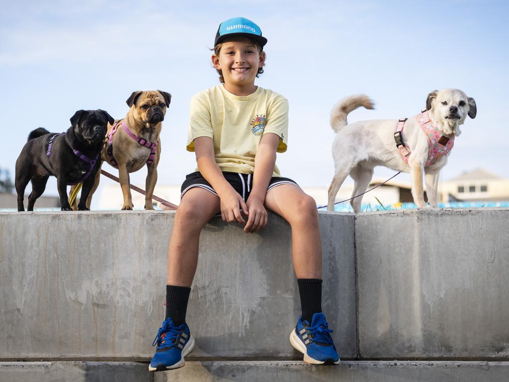 Kobe Stroem with his dogs (from left) Pickles, Waffles and Chilli, after Pickles and Waffles competed in the dock diving at the Toowoomba Royal Show, Friday, March 31, 2023. Picture: Kevin Farmer