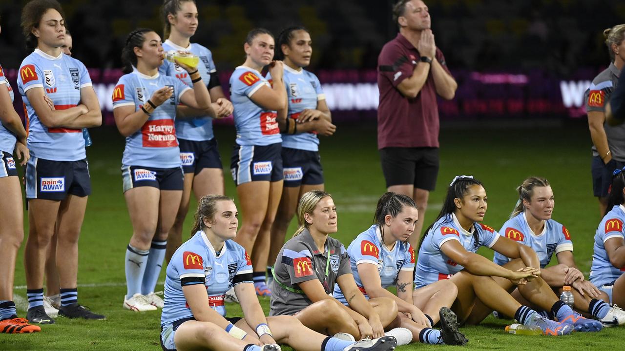 NSW Blues players look on during the trophy presentation. Picture: Getty Images