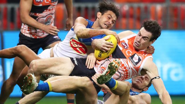 Jeremy Cameron is tackled by Jarrod Harbrow and Rory Thompson.