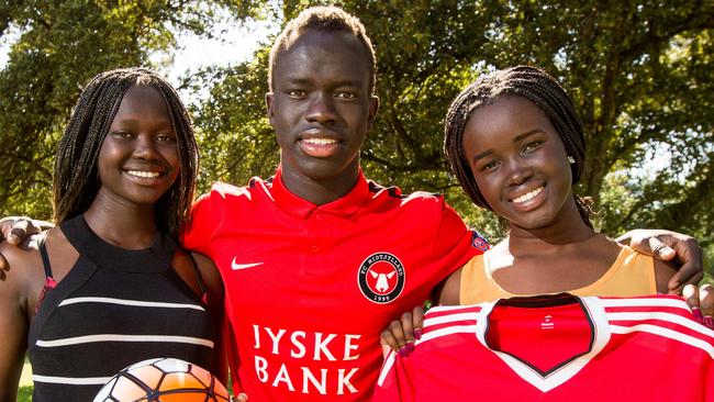 Bor Mabil, right, with her brother Awer, centre, and cousin Abiei Ajak, left. Picture: James Elsby.