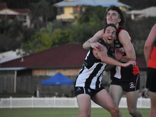 Nick Thiele (left) and Tyler Duck in the North Mackay Saints v Mackay Magpies AFL premier grand final, September 11, 2021. Picture: Matthew Forrest