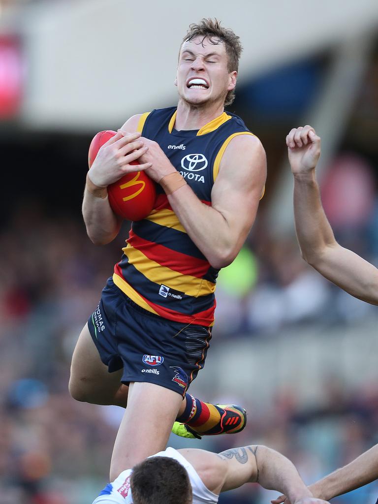 And brings it down. Picture: Sarah Reed/AFL Photos via Getty Images