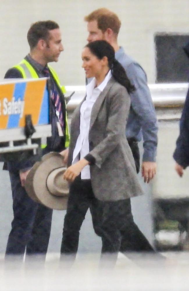 Meghan Markle and Prince Harry boarding a plane to Dubbo about 9.30am from Sydney.