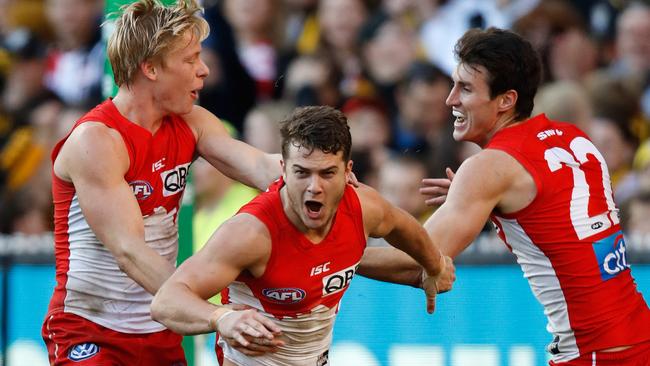 Isaac Heeney, Tom Papley and Dean Towers celebrate a vital goal against Richmond. Picture: Getty Images