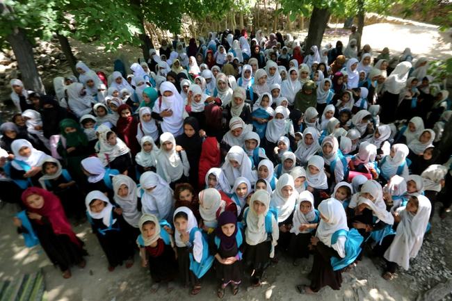 Afghan school girls attend an open-air primary school in Khogyani district of Nangarhar province in May 2023