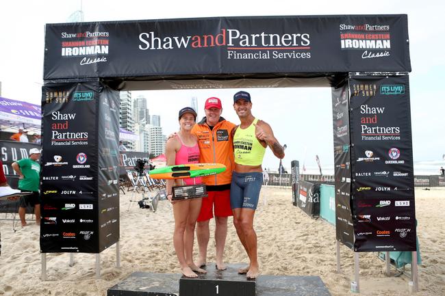 Hannah Sculley and Matt Poole won the open ironwoman and ironman races at the Summer of Surf Shannon Eckstein Classic at BMD Northcliffe. Pictured with Shaw and Partners Co-CEO Earl Evans. Picture credit: Shane Myers 2022.