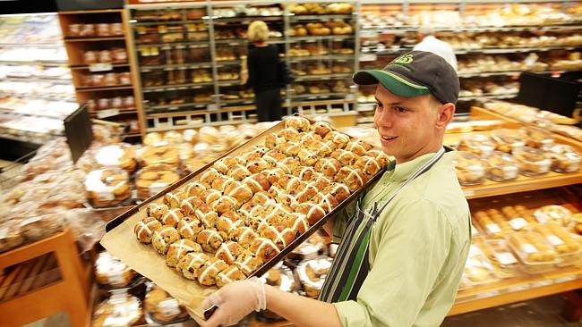 Woolworths Bakery Manager Josh Perkins at their Neutral Bay Village store in Sydney with freshly baked hot cross buns. Pictur...