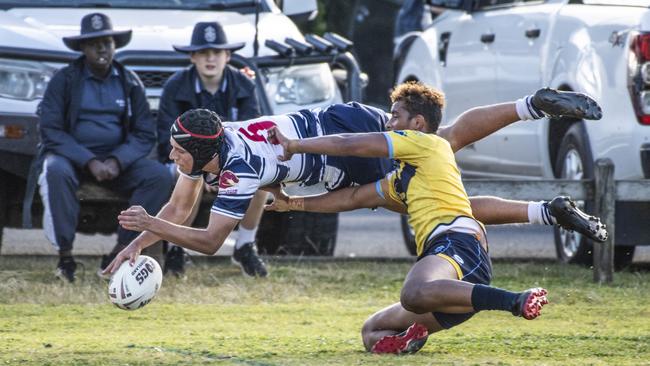 Koby Timms goes over the line to score a try for St Mary's. Picture: Nev Madsen.