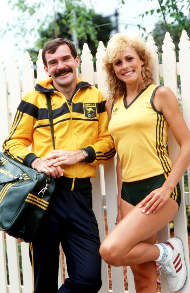 Michelle Baumgartner and Robert De Castella model the 1984 Olympic Games uniform to be worn in Los Angeles. Picture: News Corp Australia