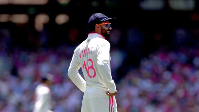 Kohli tried to get the crowd fired up. (Photo by DAVID GRAY / AFP)