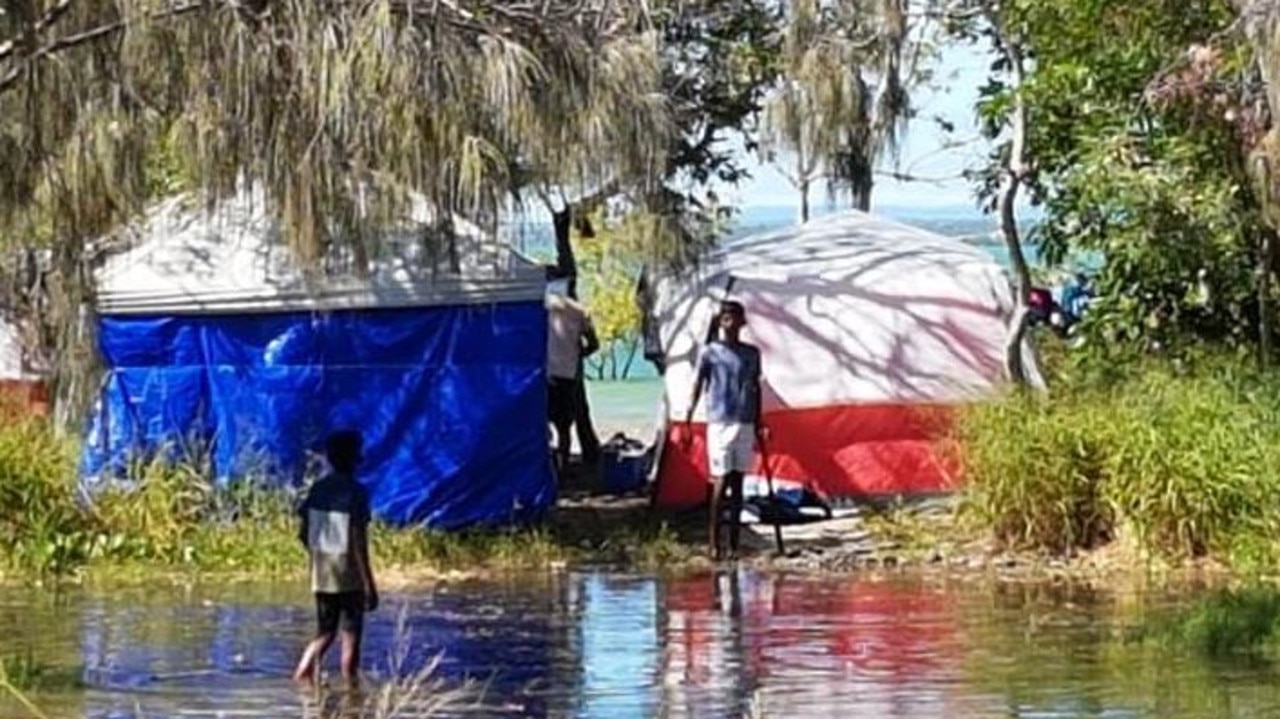 Water encroaches on a campsite at Inskip Point. Picture: Cooloola Sails