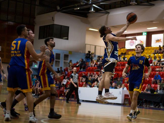 Anthony Rowse lays up a basket for Ansett against Tracy Village. Picture: Jasmine Harrison