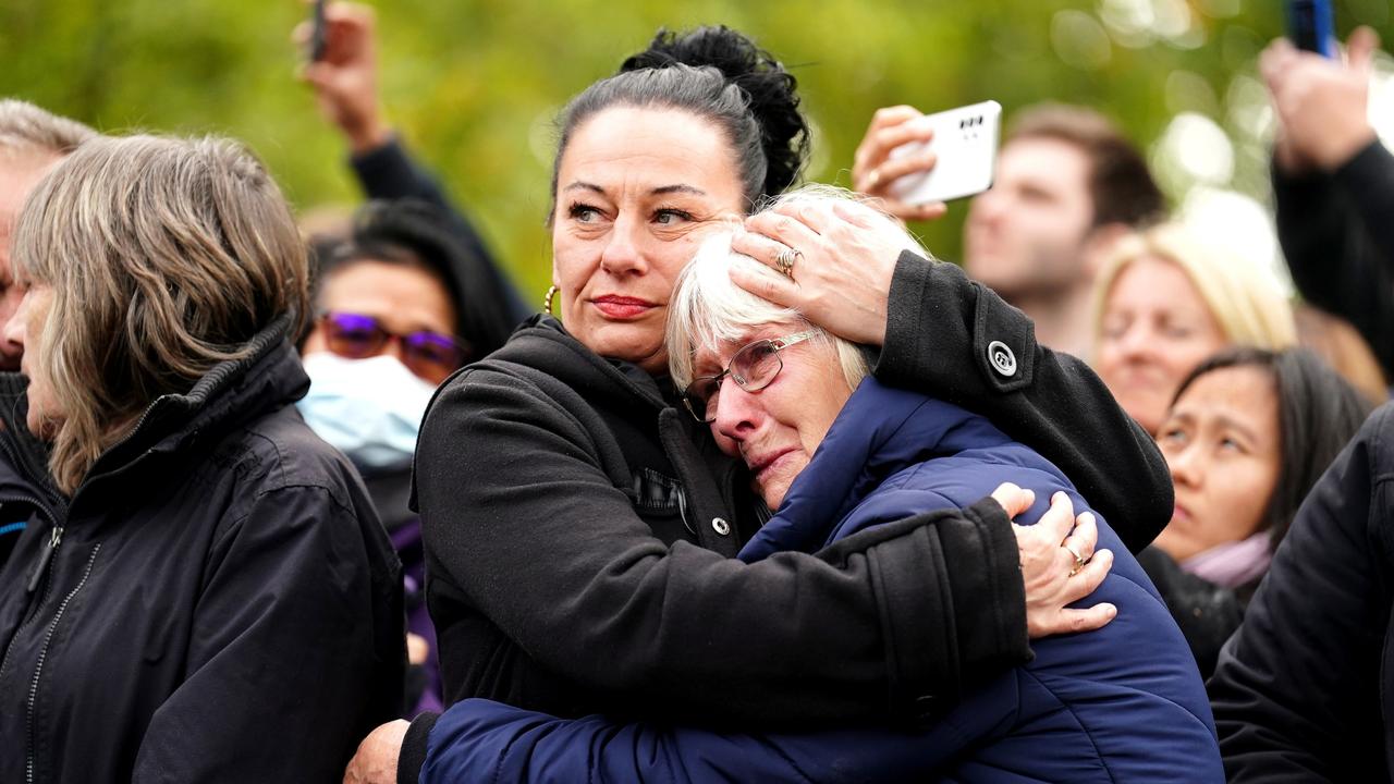 Members of the crowd listen during the State Funeral of Queen Elizabeth II. Picture: Mike Egerton – WPA Pool/Getty Images